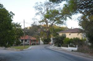 an empty street in a residential neighborhood with houses at Chalikias Rooms in Asprogerakata