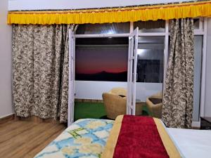 A bed or beds in a room at The Sherpa's Abode