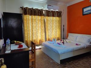 Ein Bett oder Betten in einem Zimmer der Unterkunft Gateway Himalaya Resort