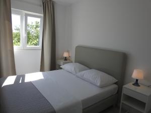 Postel nebo postele na pokoji v ubytování Apartment Salvia