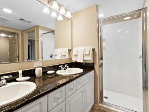 a bathroom with two sinks and a shower at Yacht Club Villas #2-405 condo in Myrtle Beach