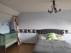Posteľ alebo postele v izbe v ubytovaní Gîte de la Forêt