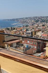 vista su una città con edifici e acqua di Chiaia Stunning SeaView StudioFlat with 2 Terraces By HouseinNaples a Napoli