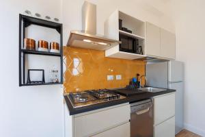 Cucina o angolo cottura di Chiaia Stunning SeaView StudioFlat with 2 Terraces By HouseinNaples