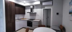 A kitchen or kitchenette at Guesting Hospital Még 6 kép