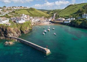 a group of boats in a body of water at The Lambing Shed, Cornwall in Altarnun