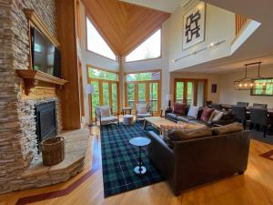 a living room with a fireplace and a couch at CR1 Top Rated Ski-In Ski-Out Townhome Great views fireplaces fast wifi AC - Short walk to slopes in Carroll