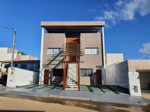 a building with a staircase in front of it at Residencial Goulart in Capitólio