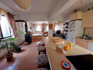 a kitchen with a wooden counter top in a room at Impeccable apartment with view in Dolna Matka in Skopje