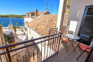 a balcony with a view of the water at Apartment Vlatka in Rogoznica