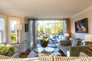 a living room with a couch and a table at The Bend in Bransgore