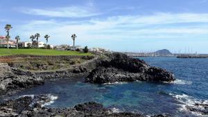 a view of a golf course and the ocean at La Quinta Villas in San Miguel de Abona