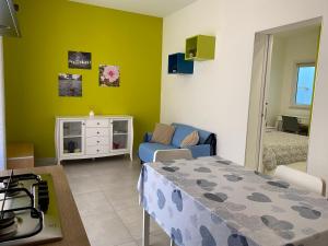 a living room with a stove and a couch in a room at Terramia in Ragusa