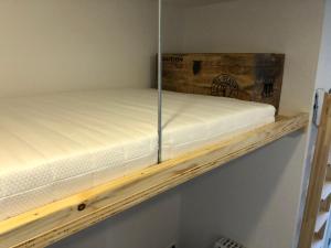 a bunk bed on a shelf in a room at Tiny House Nike in Tettnang