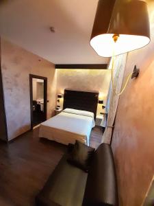 Postel nebo postele na pokoji v ubytování Hotel Continental