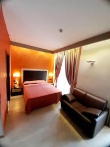 Postel nebo postele na pokoji v ubytování Hotel Continental
