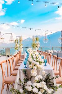 a table set up for a wedding with white flowers at Sapa Relax Hotel & Spa in Sa Pa