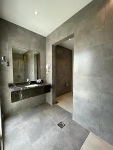 a bathroom with a sink and a mirror at Sarwat Park Hotel Jeddah in Jeddah