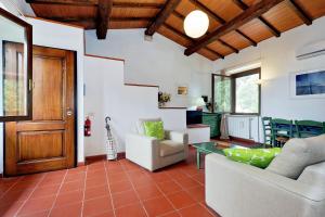 a living room with a couch and a table at Agriturismo Pimpinnacolo in Porto Ercole