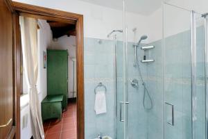 a bathroom with a shower and a glass shower stall at Agriturismo Pimpinnacolo in Porto Ercole