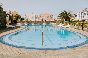Bazén v ubytovaní Acogedor adosado con piscina alebo v jeho blízkosti