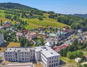 an aerial view of a small town with buildings at Residence Lysá Hora in Rokytnice nad Jizerou