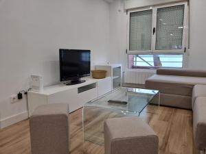 Telewizja i/lub zestaw kina domowego w obiekcie C01A01 Apartamento Moderno con vistas al mar
