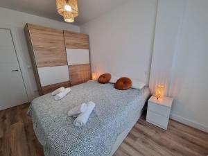 Łóżko lub łóżka w pokoju w obiekcie C01A01 Apartamento Moderno con vistas al mar