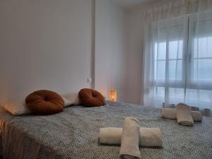 Łóżko lub łóżka w pokoju w obiekcie C01A01 Apartamento Moderno con vistas al mar