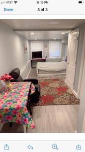 a small room with a bed and a table at EN SUITE NEXT TO FELLS POINT in Baltimore