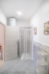 a bathroom with a shower with a glass door at DiMora RIccaFrida - Luxury Home - in Prato