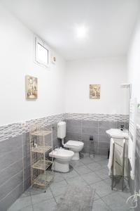 a bathroom with two toilets and a sink at DiMora RIccaFrida - Luxury Home - in Prato
