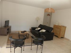 Posedenie v ubytovaní VILLA AU COEUR DE RONCE LES BAINS 200 mètres de la plage