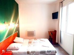 Posteľ alebo postele v izbe v ubytovaní Hôtel Central Bastille