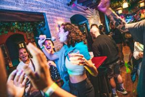 a group of people dancing at a party at Wild Rover La Paz in La Paz