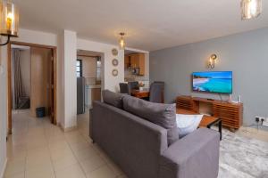 TV a/nebo společenská místnost v ubytování Athi Luxury Suites
