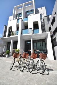 a group of bikes parked in front of a building at v2民宿 in Taitung City