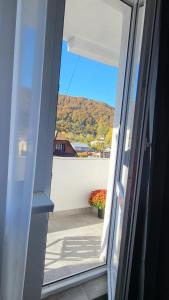 a view from a sliding glass door of a balcony at Nico in Piatra Neamţ