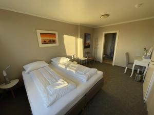 Een bed of bedden in een kamer bij Guesthouse Bitra B&B