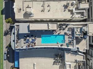 an overhead view of a swimming pool in a city at Rooftop-Pool Suite with King Bed in Ocean Dr C303 in Miami Beach