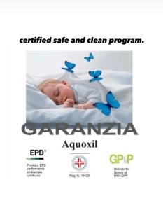 a baby sleeping on a bed with blue butterflies at Green House city center in Bologna