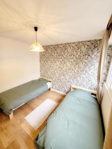 Postel nebo postele na pokoji v ubytování Le Rocher du Lac