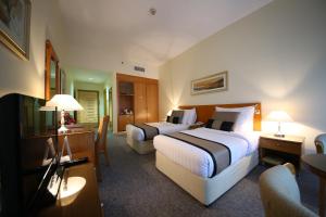 Postel nebo postele na pokoji v ubytování Lavender Hotel Deira + 37 fotografií