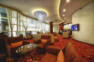 TV a/nebo společenská místnost v ubytování Lavender Hotel Deira