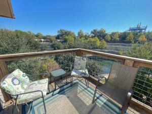 a balcony with two chairs and a table at Comal River Condo 375 in New Braunfels