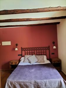 A bed or beds in a room at Hotel Molino Alto