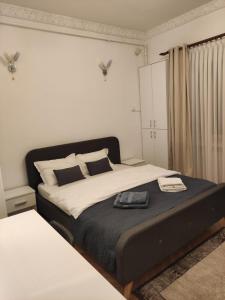 a bedroom with a large bed in a room at Royal Studio in Old Town in Bucharest