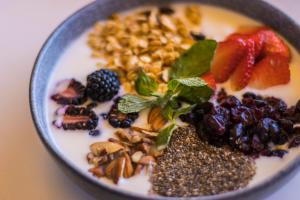 a bowl of food with nuts and fruits on it at Live Aqua Private Residences Los Cabos in Cabo San Lucas