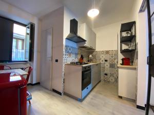 a kitchen with a sink and a stove top oven at ilpostonascosto in Isernia