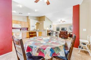 a kitchen and dining room with a table and chairs at Good Times in Goodyear in Goodyear +33 photos